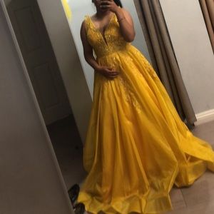 A yellow honey colored prom dress